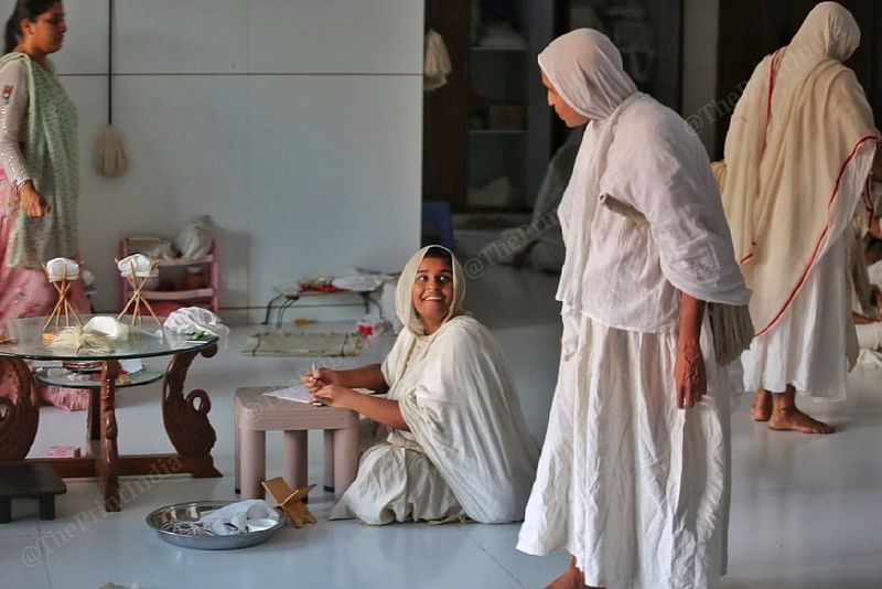 Sadhvi Tathayprgnya Shriji, 30, seen in a cheerful mood as she briefly interacts with a senior nun during her lesson at a upasraye (a resting place for monks and nuns) in Surat | Praveen Jain | ThePrint