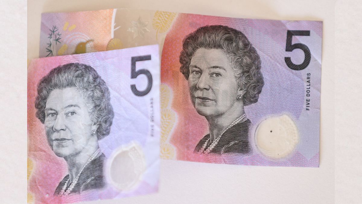 Australian $5 banknotes with a portrait of the late Queen Elizabeth II are seen in this picture illustration | Reuters Australian $5 banknotes with a portrait of the late Queen Elizabeth II are seen in this picture illustration | Reuters