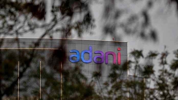 The logo of the Adani Group is seen on the facade of its Corporate House on the outskirts of Ahmedabad on 27 January 2023 | Photo: Reuters