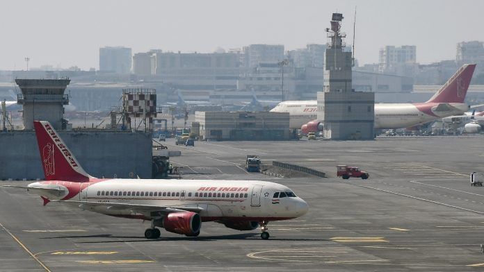 Air India planes are seen on the runway at the airport, in Mumbai | Photo: ANI Photo