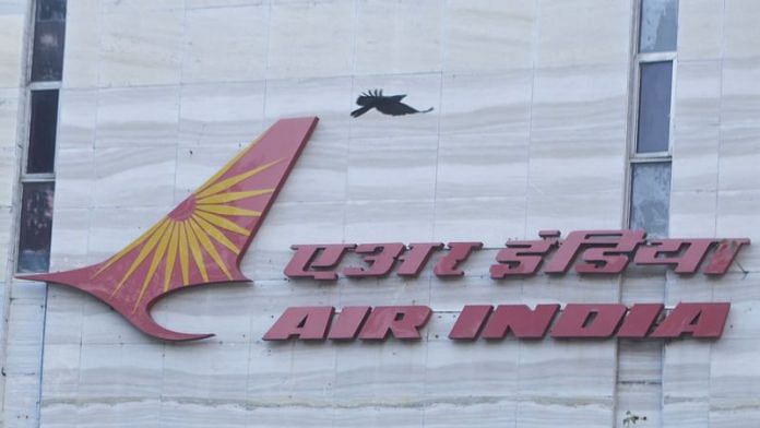 A bird flies over a logo of Air India airlines at the corporate headquarters in Mumbai, India, 19 October, 2021 | Reuters