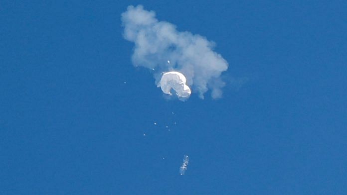 The suspected Chinese spy balloon drifts to the ocean after being shot down off the coast in Surfside Beach, South Carolina, US, on 4 February 2023 | Reuters