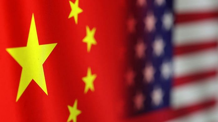 US and Chinese flags are seen in this illustration | Reuters
