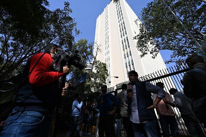 Reporters wait outside the BBC office in Connaught Place, New Delhi | ThePrint photo by Suraj Singh Bisht