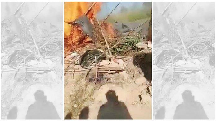 Screen grab from video of charred shanty in Madauli village