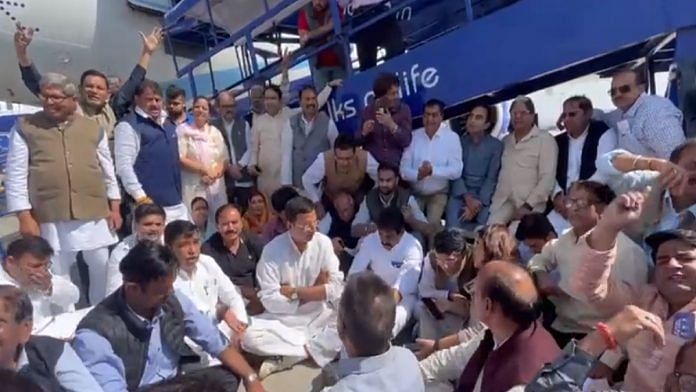 Congress leaders including Pawan Khera protesting at tarmac at IGIA Thursday | Twitter @ssrajputINC