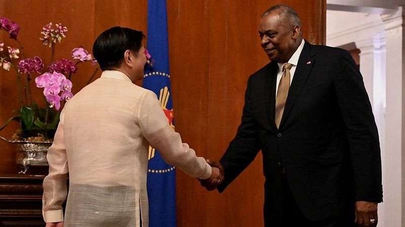 US Defense Secretary Lloyd Austin III shakes hands with Philippines President Ferdinand 