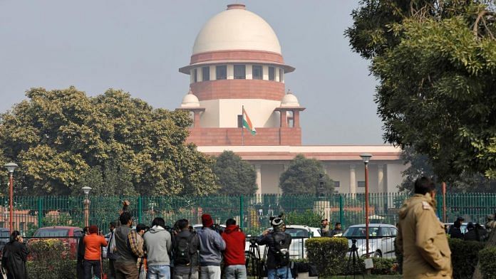 File photo of television journalists are seen outside the premises of the Supreme Court in New Delhi | Reuters