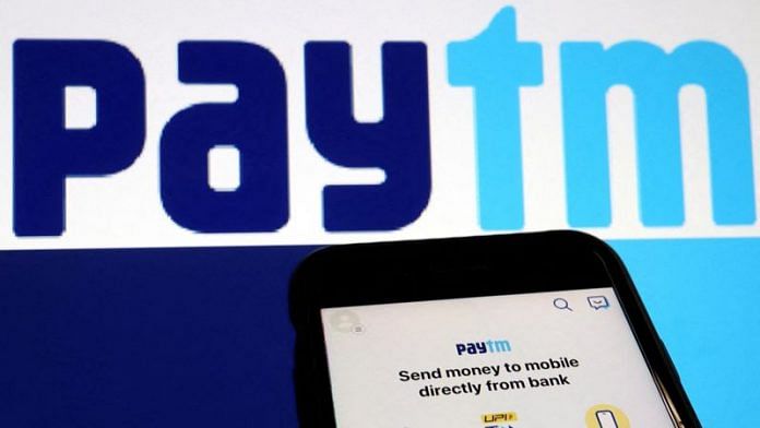 The interface of Indian payments app Paytm is seen in front of its logo displayed in this illustration picture | File Photo: Reuters