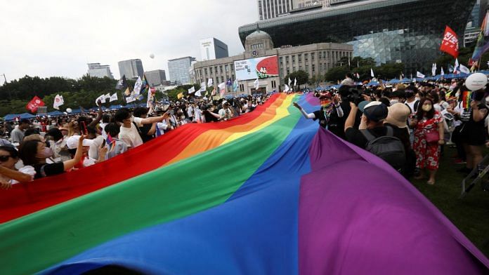 Participants wave rainbow flags during the Korea Queer Culture Festival 2022 in central Seoul, South Korea, July 16, 2022. REUTERS/ Heo Ran