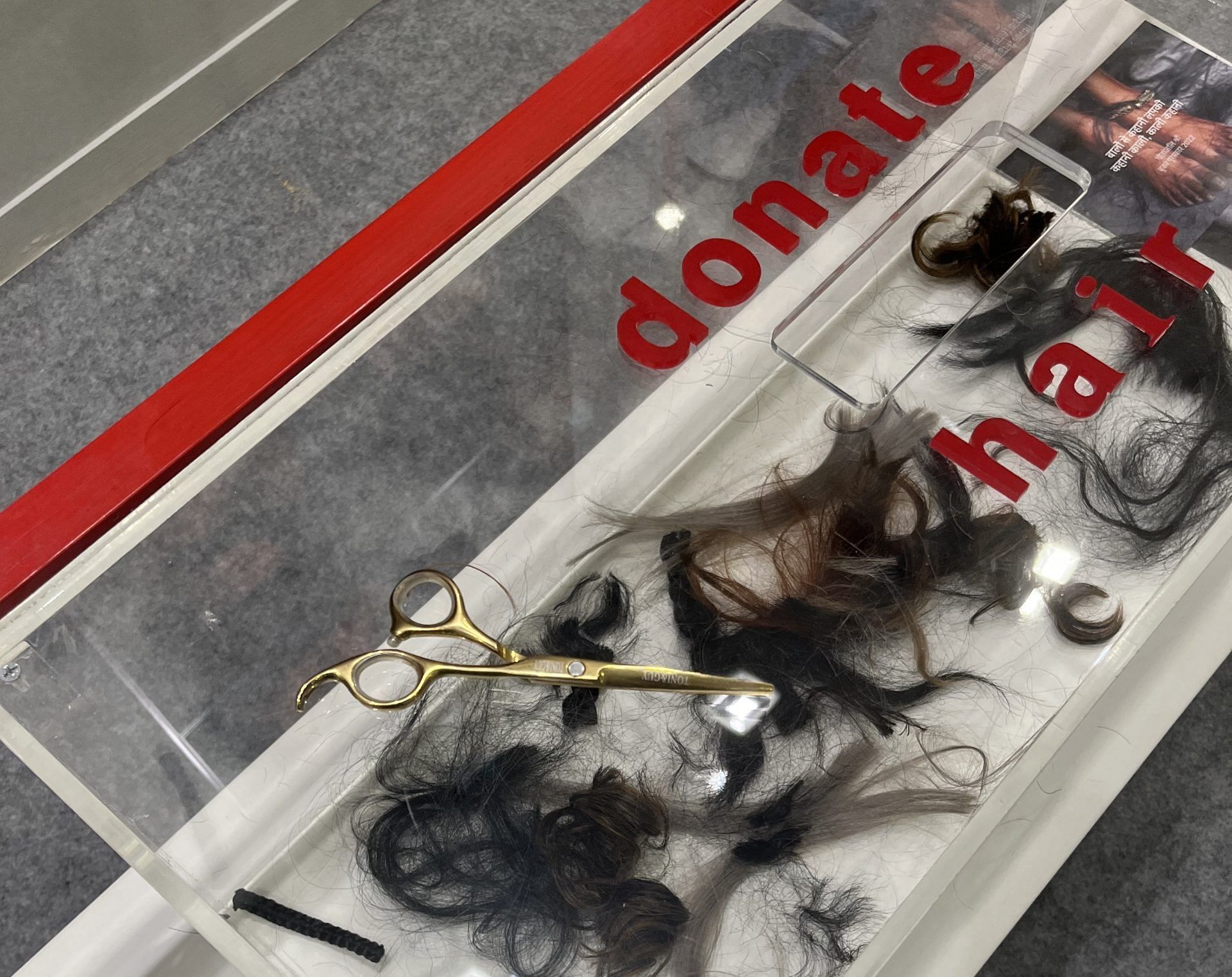 Tufts of hair in the donation box at India Art Fair 2023 | Theres Sudeep/ThePrint