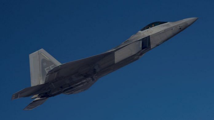 A U.S. Air Force F-22 Raptor, based out of Al Udeid Air Base, Qatar, flies alongside a KC-135 Stratotanker during an aerial refueling mission above an undisclosed location, in this undated handout picture released by U.S. Air Force on 29 July 2019 | Chris Drzazgowsk/U.S. Air Force/Handout via Reuters