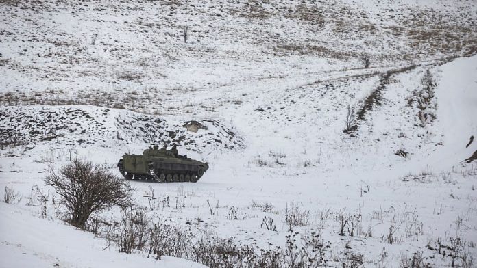 A Ukrainian serviceman rides atop of a BPM-1 infantry fighting vehicle in the frontline town of Bakhmut, amid Russia's attack on Ukraine, in Donetsk region, Ukraine 15 February 2023| Reuters/Yevhenii Zavhorodnii