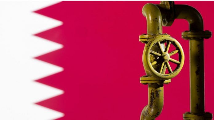 A 3D printed natural gas pipeline is placed in front of displayed Qatar flag in this illustration taken on 8 February, 2022 | Reuters