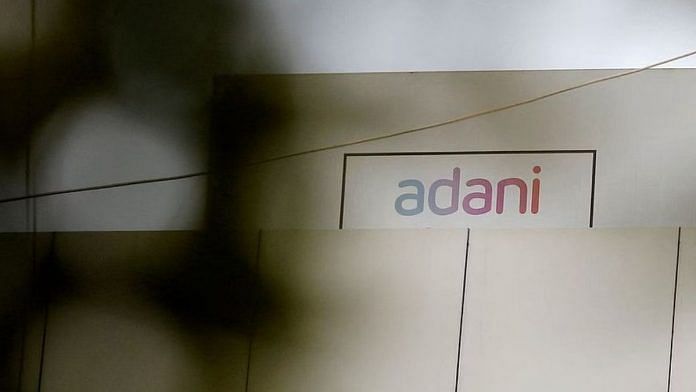 File photo of the logo of the Adani Group as seen on one of its buildings in Ahmedabad, 27 January, 2023 | Reuters
