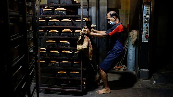 A baker pulls a cart of bread at Wish bakers shop, after the government announced a hike in power prices by 66%, in Colombo, Sri Lanka on 17 February, 2023 | Reuters