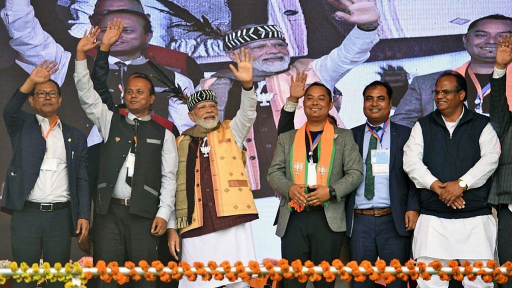 Prime Minister Narendra Modi along with Bharatiya Janata Party (BJP) leaders wave to the supporters during a public rally ahead of the Meghalaya Assembly elections, at Tura, in West Garo Hills on Friday | ANI