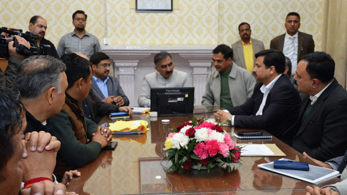 Himachal Pradesh Chief Minister Sukhwinder Singh Sukhu with representatives of Adani Cement & truck unions in Shimla on Monday | Twitter | @CMOFFICEHP