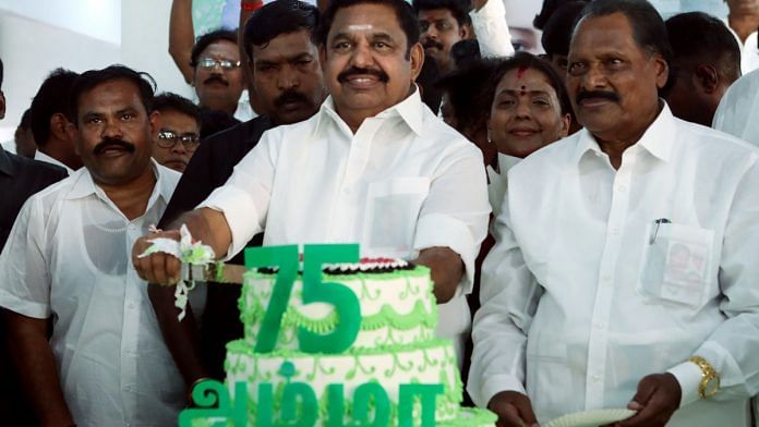 AIADMK interim general secretary E.K. Palaniswami cuts a cake on the 75th birth anniversary of former Tamil Nadu chief minister J. Jayalalithaa, at party headquarters, in Chennai Friday | ANI