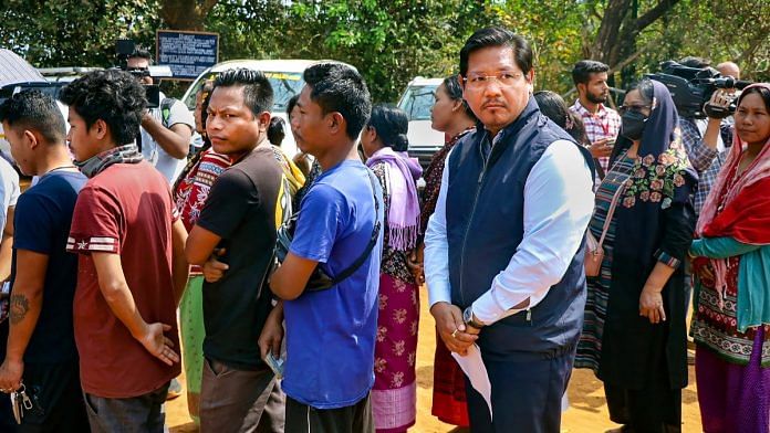 Meghalaya CM Conrad K Sangma waits in queue to cast his vote at a polling booth in West Garo Hills district | PTI photo