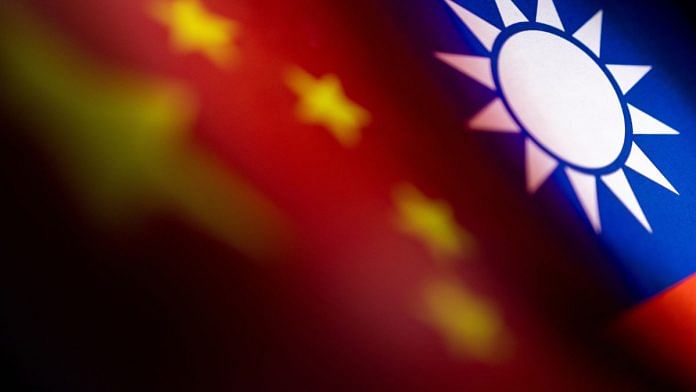 Chinese and Taiwanese printed flags are seen in this illustration taken, on 28 April, 2022 | Reuters