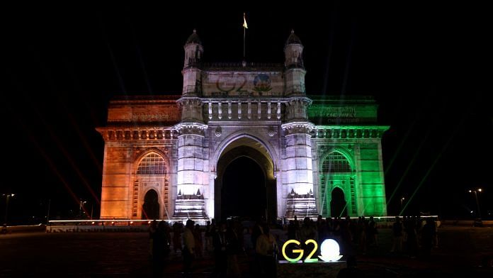 The Gateway of India monument is lit up as part of India's G20 presidency event in Mumbai on 13 December 2022 | Photo: Reuters File