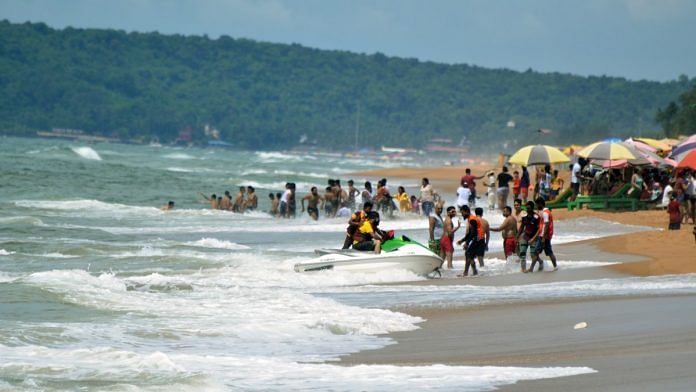 Tourists enjoy at Sinquerim beach, in Candolim, Goa | Representational image | ANI file photo