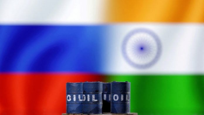 A model of oil barrels is seen in front of Russian and Indian flags | Illustration: Reuters/Dado Ruvic