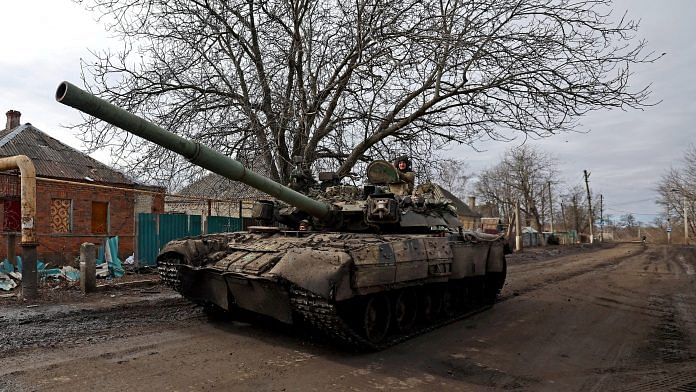 Ukrainian servicemen ride a tank on a road towards the frontline town of Bakhmut amid Russia's attack on Ukraine, in Chasiv Yar, Donetsk region on 2 March, 2023 | Reuters