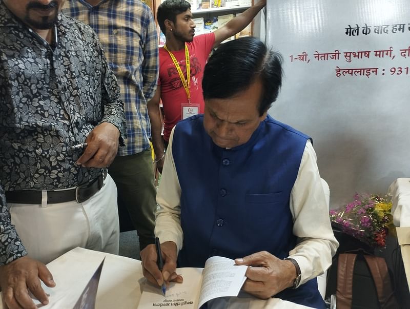Ali Anwar signing his book at the launch of 'Sampoorna Dalit Andolan — Pasmanda Tasavvur' | Photo: Heena Fatima | ThePrint 