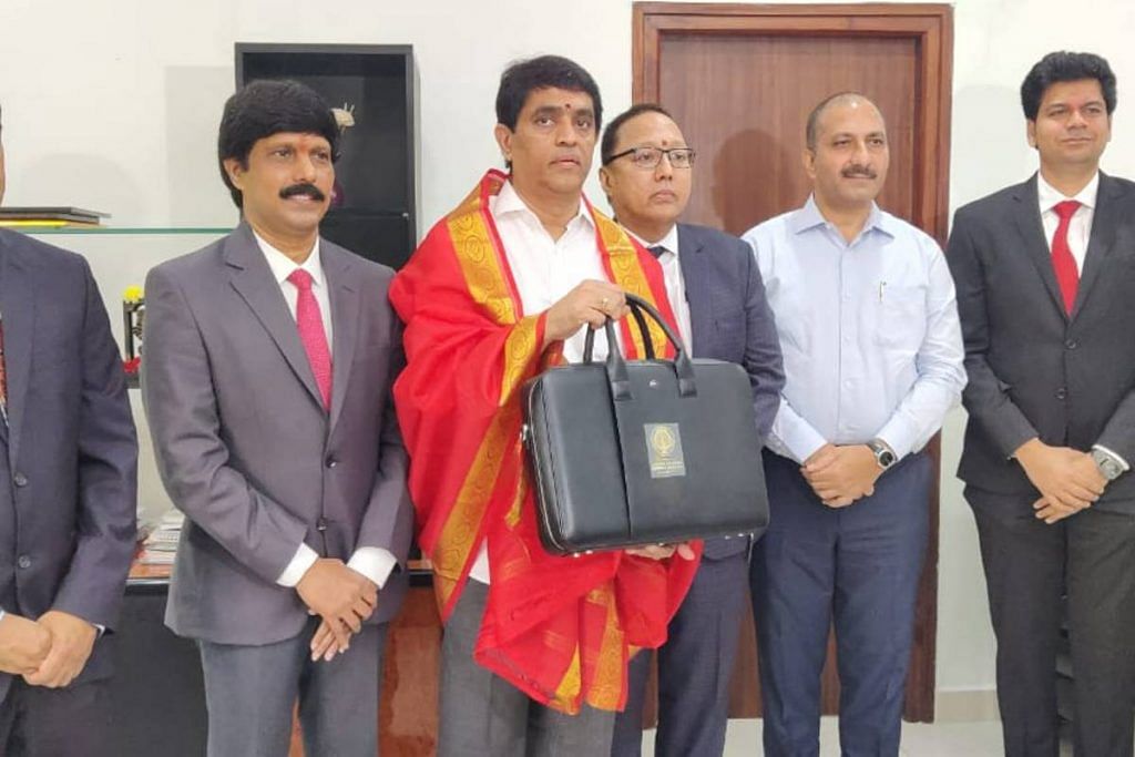 Andhra Pradesh Finance Minister Bugganna Rajendranath (in the middle) with officials carrying the Budget for FY 2023-24| photo by special arrangement