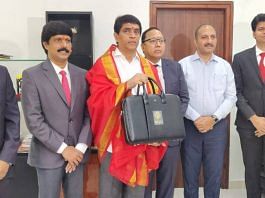Andhra Pradesh Finance Minister Bugganna Rajendranath (in the middle) with officials carrying the Budget for FY 2023-24| photo by special arrangement