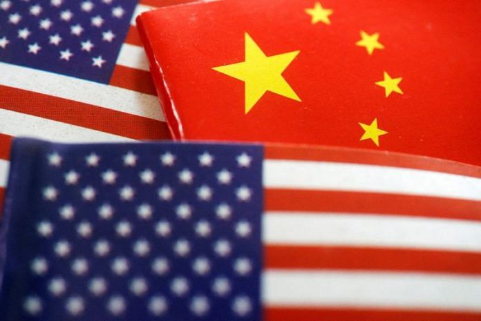 Flags of U.S. and China are seen in this illustration | Reuters