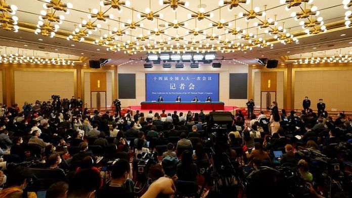 Journalists attend a news conference by Chinese Foreign Minister Qin Gang on the sidelines of the National People's Congress (NPC) in Beijing, China on 7 March, 2023 | Reuters