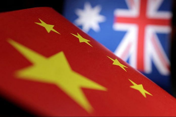 Printed Chinese and Australian flags are seen in this illustration | Reuters
