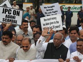 Congress President Mallikarjun Kharge, along with MPs of other opposition parties, holds a "Democracy in Danger" banner during a protest march towards Rashtrapati Bhawan in New Delhi on 24 March | Photo: Suraj Singh Bisht/ThePrint