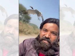 Screenshot of a video of Arif and the Sarus crane | Twitter/@gyanu999
