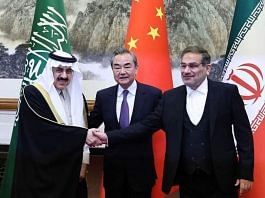 China's top diplomat Wang Yi with Ali Shamkhani, Iran’s Supreme National Security Council secretary, and Minister of State & national security adviser of Saudi Arabia Musaad bin Mohammed Al Aiban pose for pictures during a meeting in Beijing, on 10 March 2023 | China Daily via Reuters