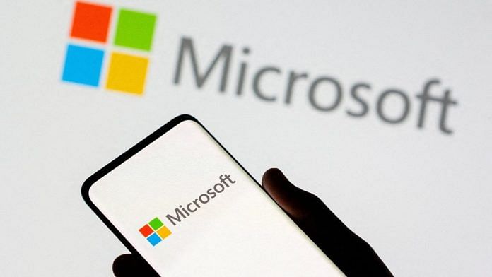 File photo of a smartphone seen in front of Microsoft logo displayed in this illustration taken, 26 July, 2021 | Reuters