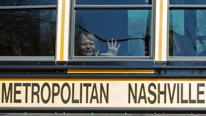 A child weeps while on the bus leaving The Covenant School, following a mass shooting at the school in Nashville, Tennessee, US 27 March, 2023 | Reuters