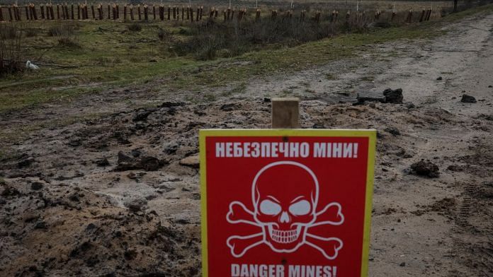 File photo of a mine danger sign & anti-tank constructions are seen near the border with Belarus, amid Russia's attack on Ukraine in Volyn region, Ukraine 13 January, 2023 | Reuters