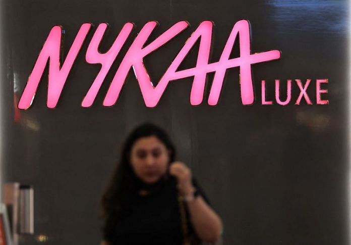 A woman walks past a store of Nykaa at a mall in New Delhi | Reuters file photo