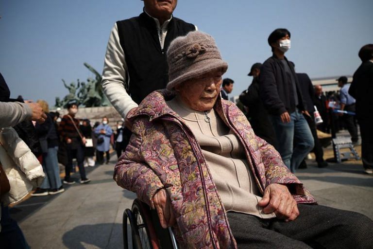 Forced labour victims reject South Korea deal on Japan, protest in wheelchairs