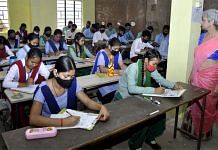 File photo of students taking an exam at a government school in Assam | ANI