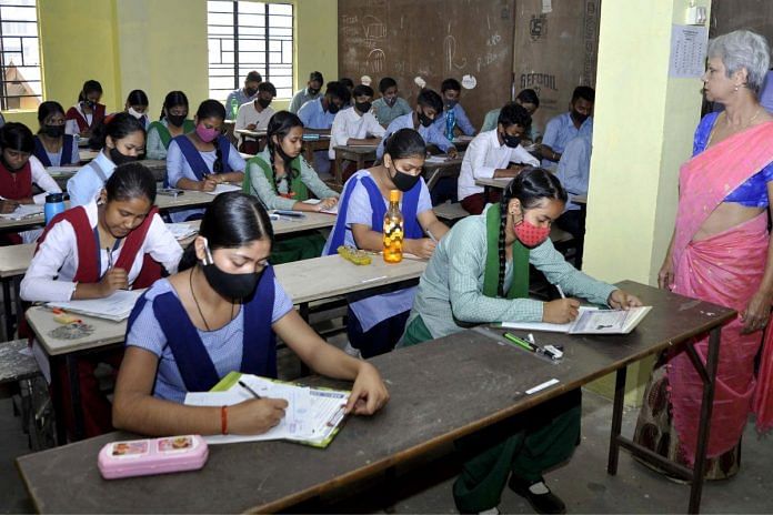 File photo of students taking an exam at a government school in Assam | ANI