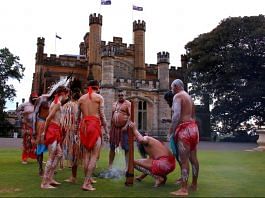 Australian Aborigines and Torres Strait Islanders wearing traditional dress stand in front of Government House after performing in a welcoming ceremony in Sydney | File Photo: Reuters