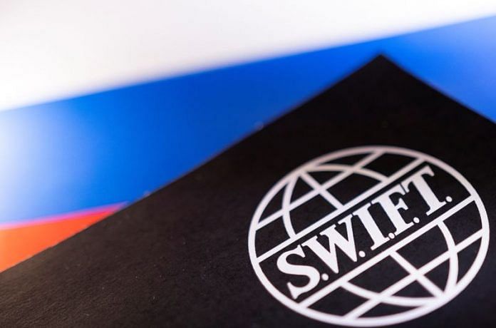 Swift logo is placed on a Russian flag are seen in this illustration taken, Bosnia and Herzegovina, 25 February | Reuters/Dado Ruvic/Illustration