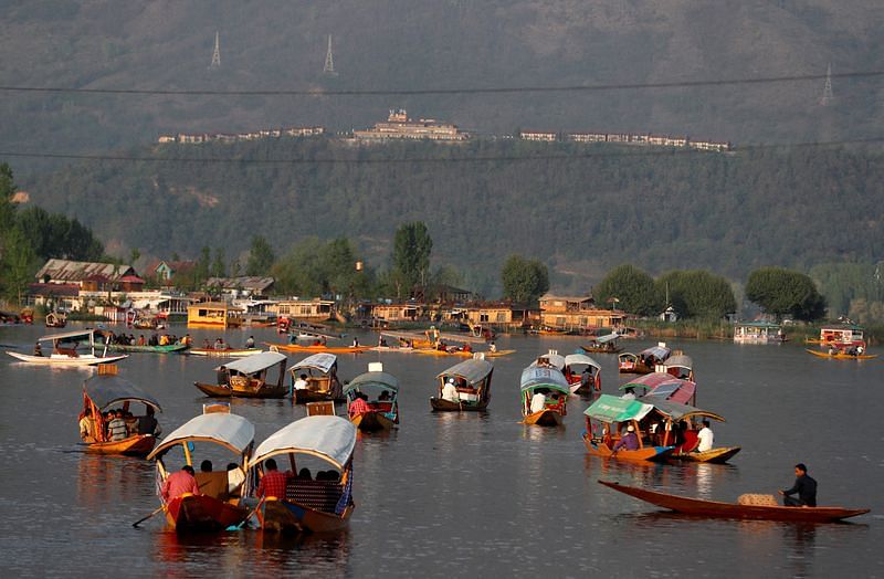 Tourists ride "Shikaras" or boats in the waters of Dal Lake in Srinagar | File Photo: Reuters
