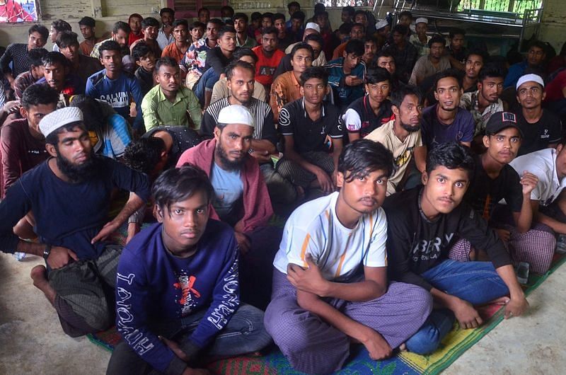 Rohingya refugees sit inside a temporary shelter after they landed in Kuala Matang Peulawi, East Aceh, Indonesia on 27 March, 2023, in this photo taken by Antara Foto | via Reuters