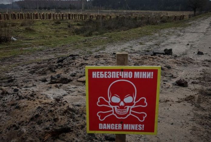 A mine danger sign and anti-tank constructions are seen near the border with Belarus | Reuters file photo